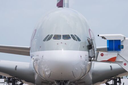 Singapore - February 17, 2016: Front of an Airbus A380 in the livery of Qatar Airways during Singapore Airshow at Changi Exhibition Centre in Singapore.のeditorial素材