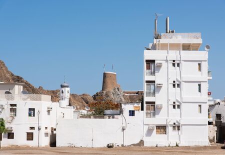 Residential area in Muscat, The Sultanate of Oman, with the ancient Fort  Al-Mirani in the background.のeditorial素材