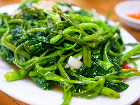 Vietnamese fried morning glory, rau muong xao toi. This is a popular dish across large parts of...
