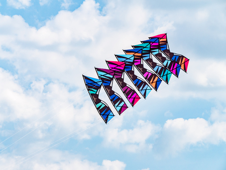 Satun, Thailand - February 23, 2019: Stack of 8 quad line kites flying at Satun International Kite Festival in Thailand. This was the 39th Satun festival, with participants from 37 nations worldwide.のeditorial素材