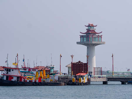 The pagoda style lighthouse at the harbour of Ko Sichang, an island off the coast of the Chonburi Province in Thailand. Ko Sichang is a centre of commercial shipping in addition to being a popular weekend destination for local tourists. At the beginning oのeditorial素材