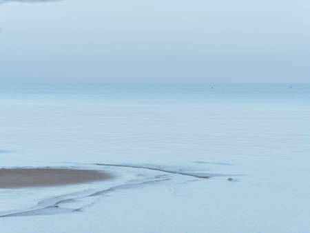 Beach and sea at dawn on the coast of Surat Thani province in Thailand.の写真素材