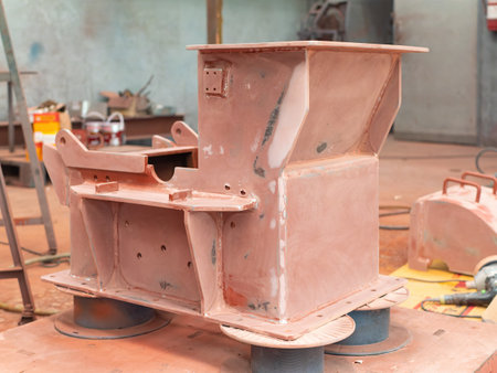 Hammer mill with a first layer of prime coating at industrial paint shop.の写真素材