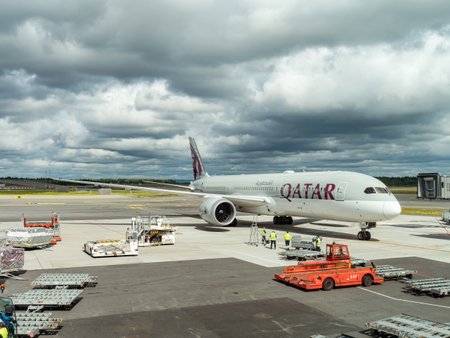 Gardermoen, Norway - August 22, 2022: Qatar Airways Boeing 787-9 arriving at a gate of Oslo Airport, Gardermoen.のeditorial素材