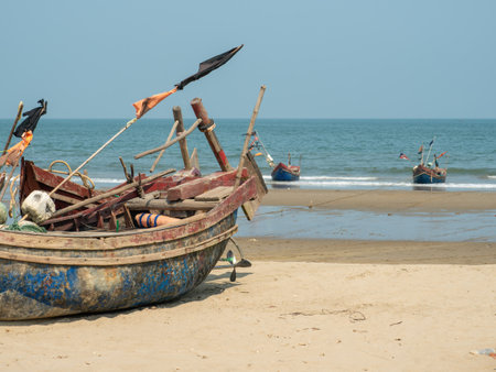Traditional Vietnamese fishing boats beached at Sam Son beach, Thanh Hoa Province of Vietnam.の写真素材