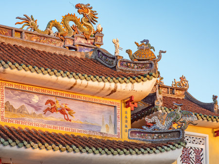 Roof detail of the Phap Bao Temple in Hoi An, Quang Nam province, Vietnam. The old city of Hoi An is a World Heritage Site, and famous for its well preserved buildings and street structure dating back from the days when it was a major trading port.のeditorial素材