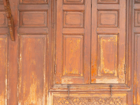 Detail of wooden window on a teak house in Thailand.の写真素材