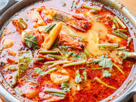 The famous Thai soup, tom yam kung, a hot and sour soup with prawns and herbs, popular among tourists to Thailand as well as Thai people.の写真素材