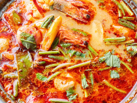 The famous Thai soup, tom yam kung, a hot and sour soup with prawns and herbs, popular among tourists to Thailand as well as Thai people.の写真素材