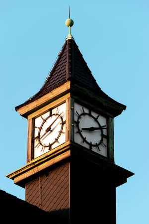 Tower clock in Rostock with sunset light