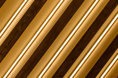 Abstract gold, wooden and light striped background. Wallpaper and background.の写真素材