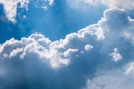 Blue sky with fluffy clouds. Nature background