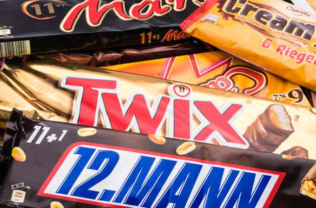 Germany - June 21, 2016: different sweets. Candy heap. Snickers, Mars Twix Cream Empty calories