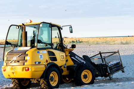 Rostock, Germany - August 19, 2016: Volvo L20F wheel loader at the beach of Rostock-Warnemuende. Coastal management.のeditorial素材