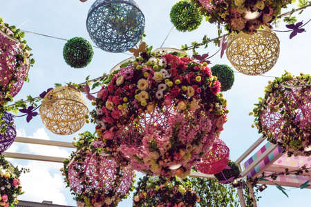 Background colorful street decoration, flower lanterns. Festivals and festivalsの写真素材