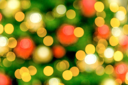 Christmas tree background. abstract bright blurred colorful background with shimmering glitter.の写真素材