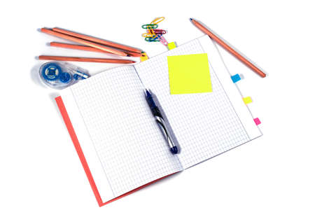 Top view of school workspace with notebook pen and stickers. Isolated on white background. Back to...