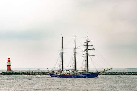 Sailing ship on the sea. Tall Ship and lighthouse Yachting travel.の写真素材