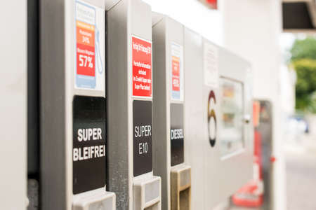 Gas pump nozzles in service station. Benzineの写真素材