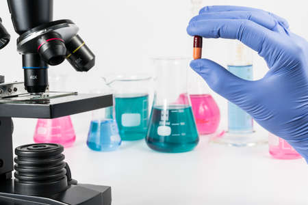 Analysis of medicaments in laboratory. Medical Research and diseases Science. Microscope and laboratory vesselsの写真素材