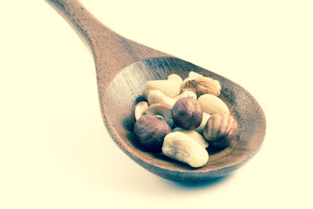nuts in wooden spoonの写真素材