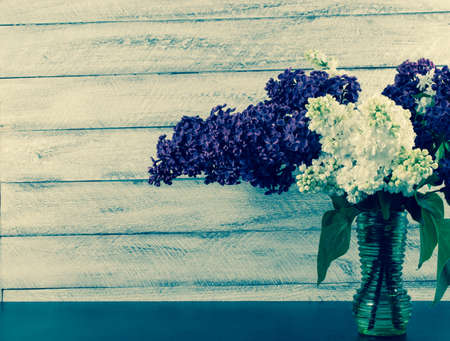 lilac flowers on wooden background. Postcard, cover, card copy spaceの写真素材