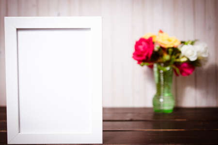 flowers with chalkboard on wooden table. copy space and celebration concept