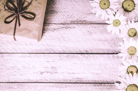 Present box onwooden background. greeting card holidays concept.の写真素材