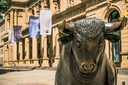 Frankfurt, Germany - July 27, 2017: Bear and Bull sculpture. Frankfurt Stock Exchange building.のeditorial素材