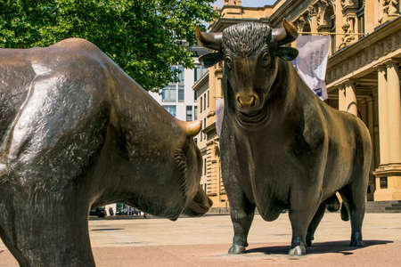 Frankfurt, Germany - July 27, 2017: Bear and Bull sculpture. Frankfurt Stock Exchange building.のeditorial素材