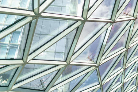 Abstract background construction. close-up of modern aluminum triangles on facade