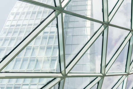 Abstract background construction. close-up of modern aluminum triangles on facadeの写真素材