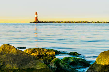 red lighthouse of Warnemuende on the Baltic Sea at the harbor ,の写真素材