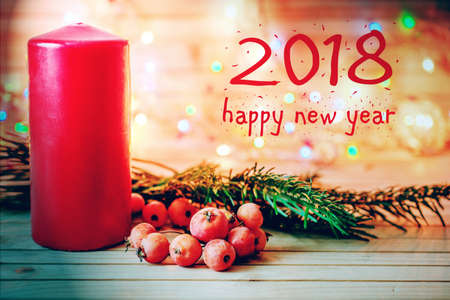 Christmas wooden background with candle and decor. new year and