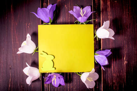 green mockup card with copy space, hearts, sale chalkboard, pink sale label and rose leaves on wooden background. sale, greeting and celebration card concept.の写真素材