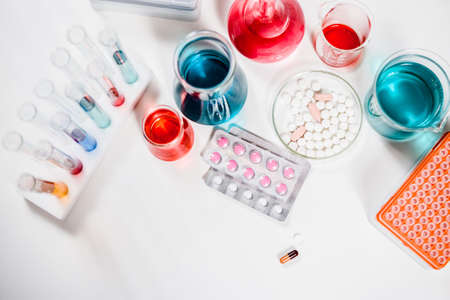 pills and test tubes in laboratory. drug discovery, pharmacology and biotechnology concept. science and medical research background.の写真素材