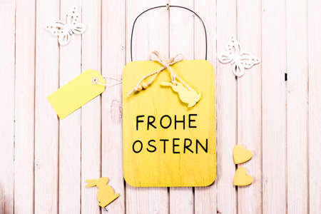 Easter chalkboard with blank sale tag or label and copy space. happy easter in german language