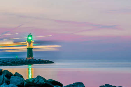 night view of lighthouse of Warnemuende on the Baltic Sea at theの写真素材