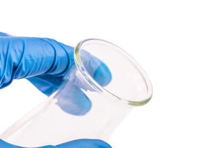hand of scientist hold empty chemical laboratory beaker. Research science and medical laboratory.の写真素材