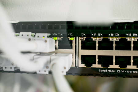Network cables in network server and connections on switchの写真素材
