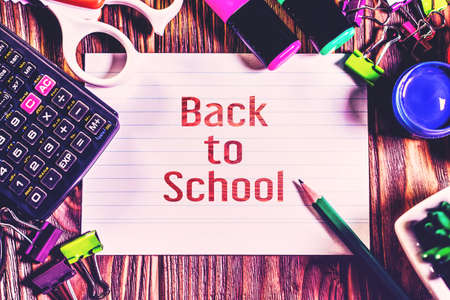 ack to school background with school supplies on wooden background.の写真素材