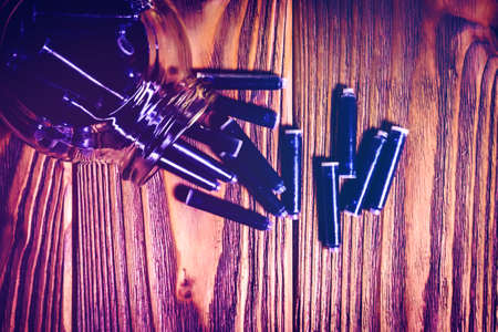 jar of fountain pen ink refill cartridges on wooden background. Back to school, world writers day, fathers day, world poetry and happy book day concept. greeting card and border template.の写真素材
