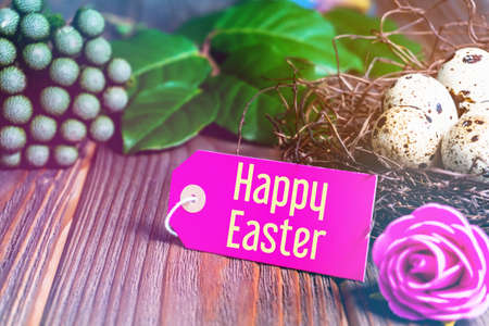 Happy Easter! Easter greeting card. quail eggs in the nest.の写真素材