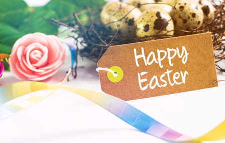 Happy Easter! Easter greeting card. quail eggs in the nest.の写真素材