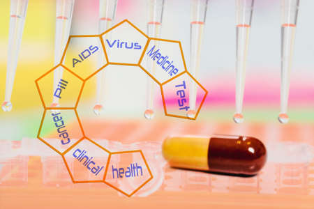 pill closeup and pipette tips with sample drops.