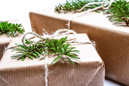 christmas gift. Xmas gifts on wooden background. christmas presents with Fir tree branches. Xmas...