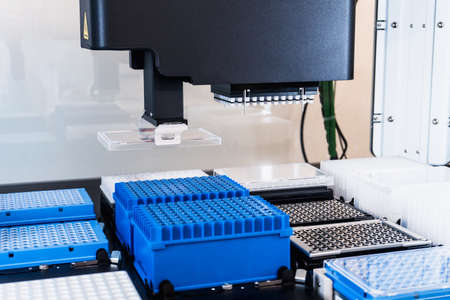 Automation in the clinical laboratory. Pipetting robot laboratory. Medicine robotics. NGS DNA diagnostics. Research and science backgroundの写真素材