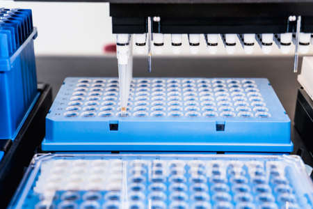 Automation in the clinical laboratory. Pipetting robot laboratory. Medicine robotics. NGS DNA diagnostics. Research and science backgroundの写真素材