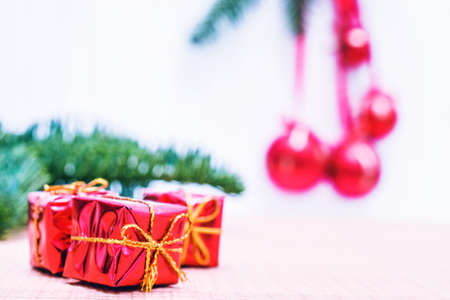 Happy Christmas. Christmas gift. Xmas gifts and presents with fir tree branches. Xmas greeting card and border with copy spaceの写真素材