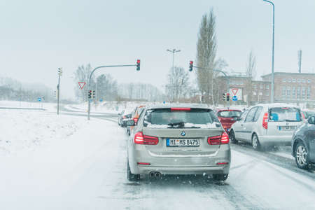 Rostock, Germany - april 24, 2018: snow covered car drives in winter stormのeditorial素材